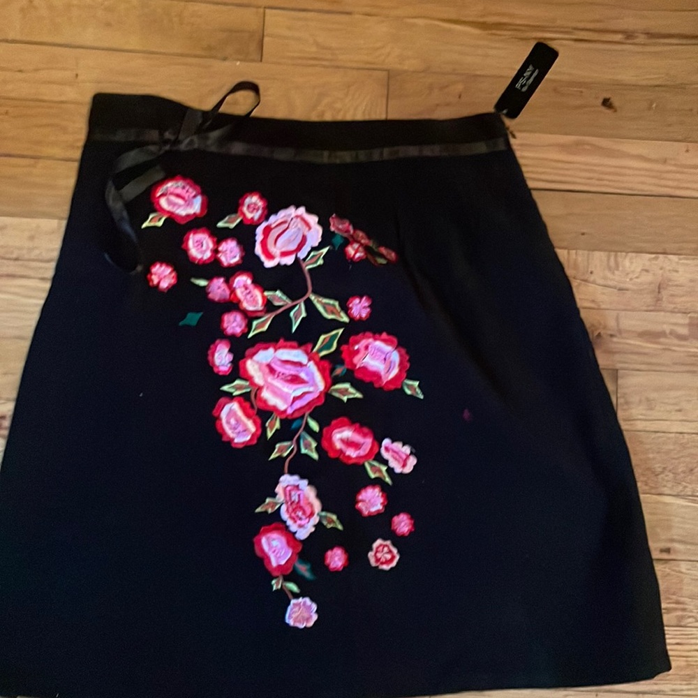 Never worn velvet skirt. Fully lined.Embroidery  flowers on front.